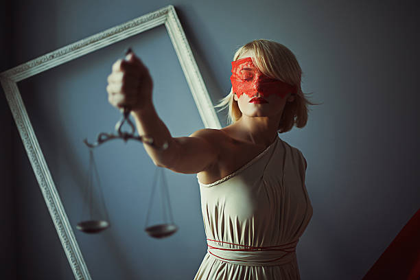 Sign of justice with scales Sign of justice photo of young woman with scales red blindfold stock pictures, royalty-free photos & images