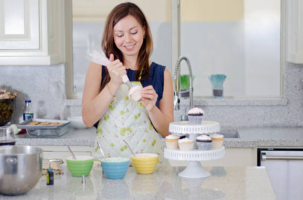 istock Pretty housewife making cupcakes 177711171