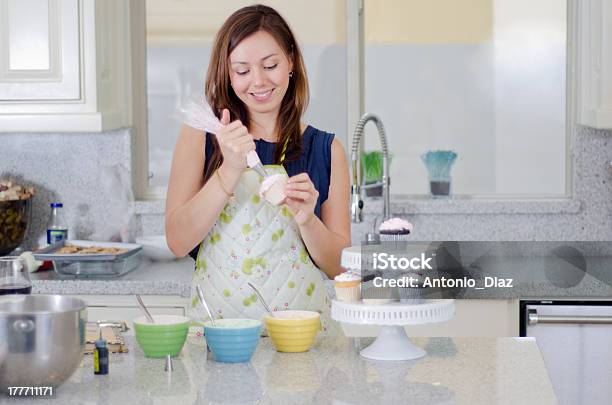 Pretty Housewife Making Cupcakes Stock Photo - Download Image Now - Adult, Adults Only, Apron