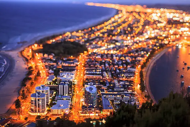 The city of Tauranga, New Zealand where yellow illuminated by his own city lights.