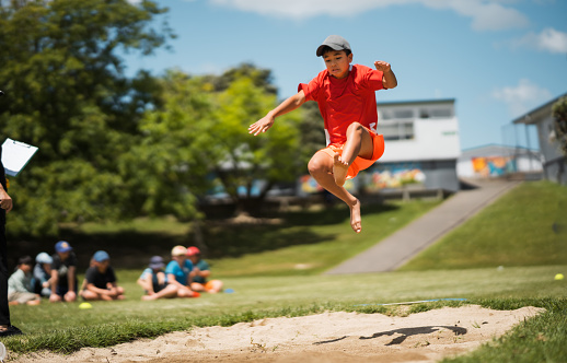 Young athletes pole vault seems to reach the sky