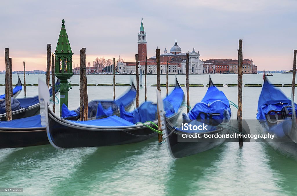 Gondolas in Venice Gondolas on the Grand Canal lagoon  Saint Marks Square Venice Church Stock Photo