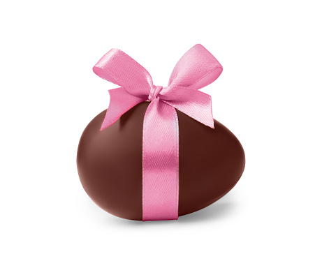 Sweet chocolate egg with pink bow isolated on white
