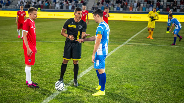 istock Soccer team captains flipping coin 1777139518