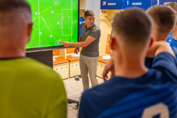 istock Football coach showing game strategy on screen 1777139522