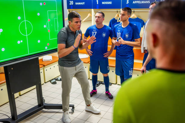 istock Football coach showing game strategy on screen 1777139586