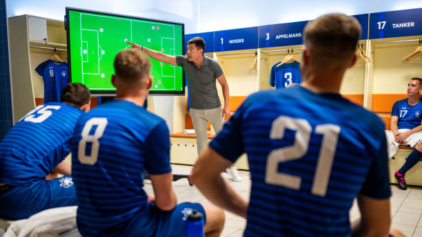 Soccer coach showing players positioning on screen