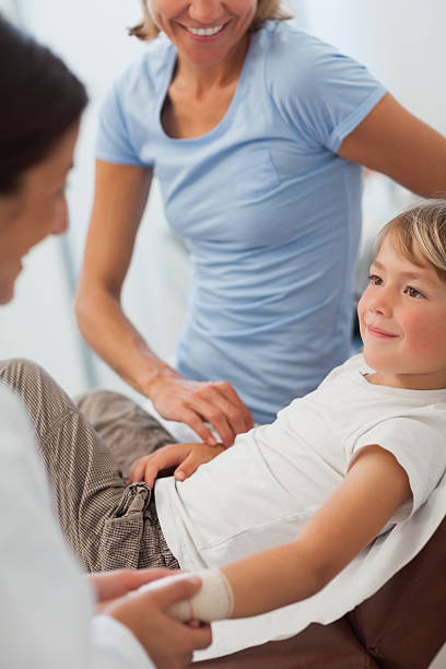 istock Doctor doing bandage to a child 177714215