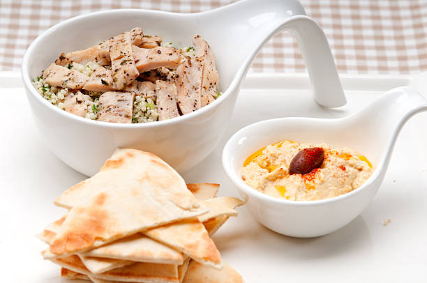 fresh traditional arab chicken taboulii couscous with hummus