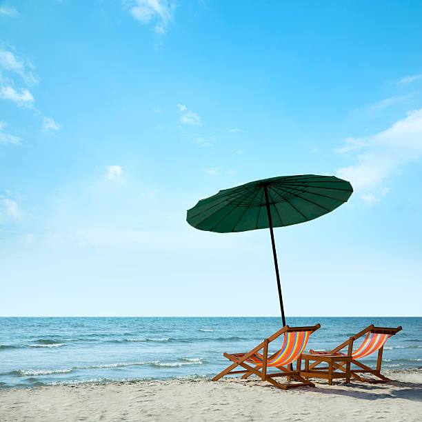 istock Beach chairs and umbrella on beach. 177714563