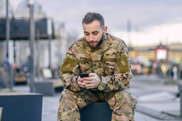 istock A military soldier sits on a bench at a bus stop waiting for a b 1777146167