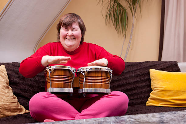 istock Mentally disabled woman with music therapy 177715495
