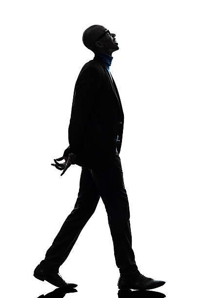 istock african black man walking looking up smiling silhouette 177715691