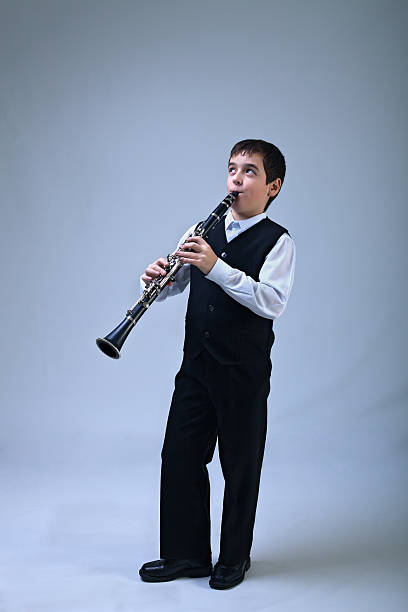istock Boy playing on the clarinet 177715750