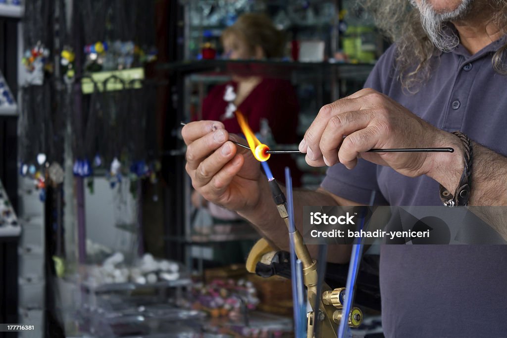 Shaping Glass Glass Artist Melting And Re-shaping Glass With The Aid Of A Bunsen Burner Art Stock Photo