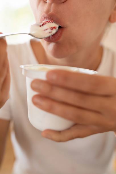istock woman eats yogurt with a spoon. healthy eating 1777165417