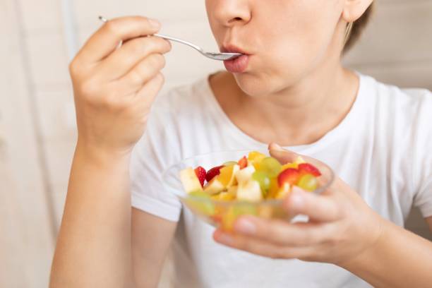 istock young woman snacking on sweet fruits 1777165983