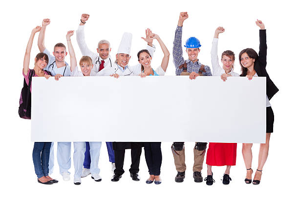 Multicultural people holding a blank banner Large group of people representing diverse professions including sign human hand pointing manual worker stock pictures, royalty-free photos & images