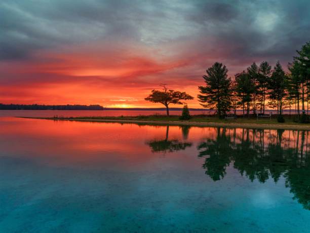 Detroit Point Calm Colorful Sunrise. Higgins Lake, Michigan