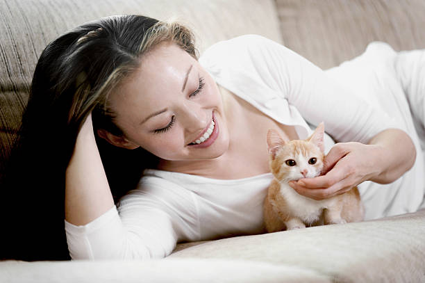 istock Pretty Woman on the sofa with red kitten 177717970