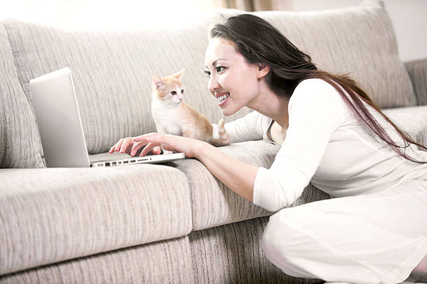 istock Attractive Young Woman With Computer and Kitten 177718325