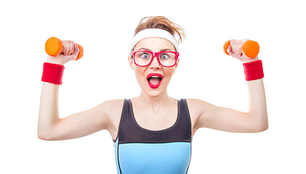 Funny woman with dumbbell stock photo