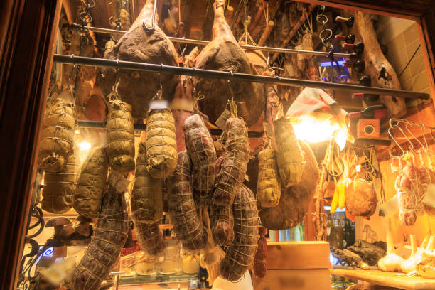 istock Salami and prosciutto hanging in shop window 1777188812