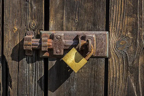 Old key lock on wooden door