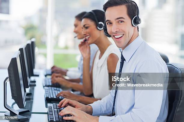 Joyful Agent Working In A Call Centre Stock Photo - Download Image Now - 20-29 Years, Adult, Adults Only