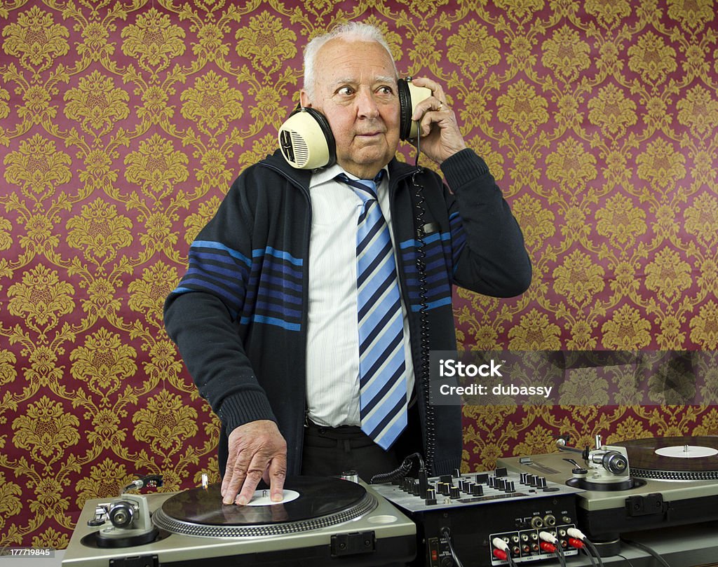 grandpa dj a very funky elderly grandpa dj mixing records Senior Adult Stock Photo