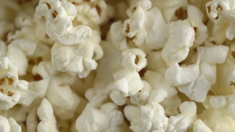 Popcorn close up. Healthy food concept. Movie food concept. Popcorn falling down