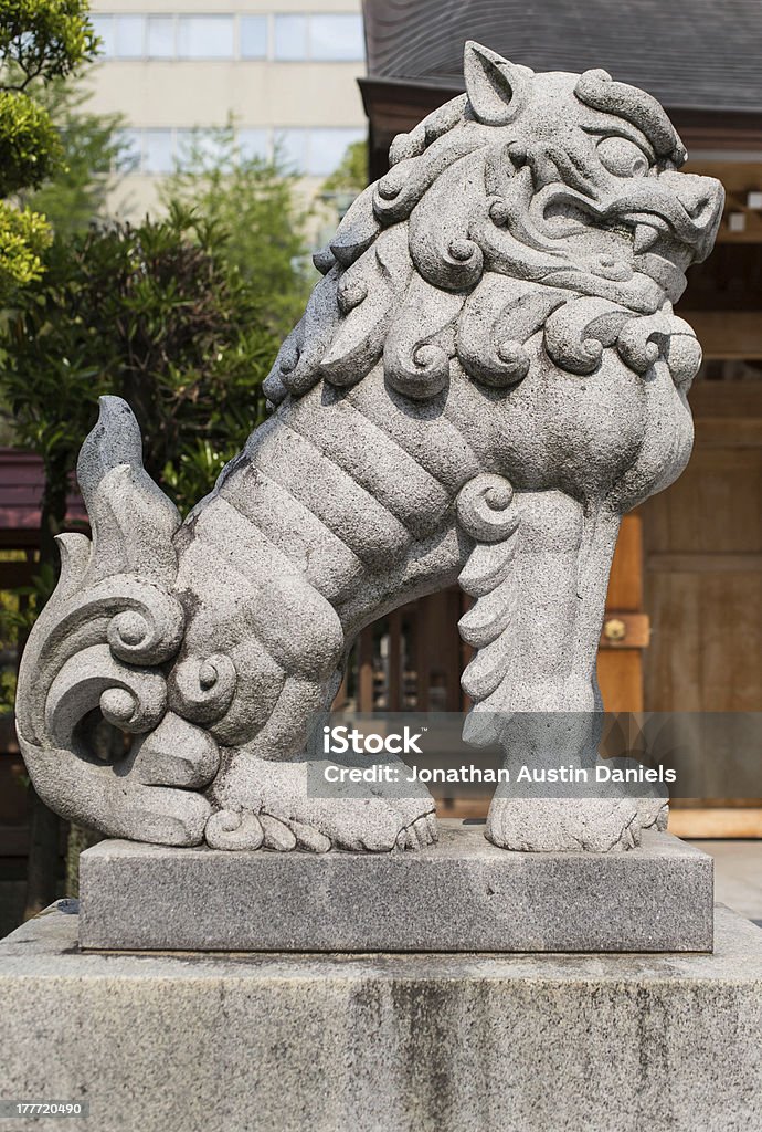 Lion-dog Statue Lion-dog statue made of stone. Komainu Stock Photo