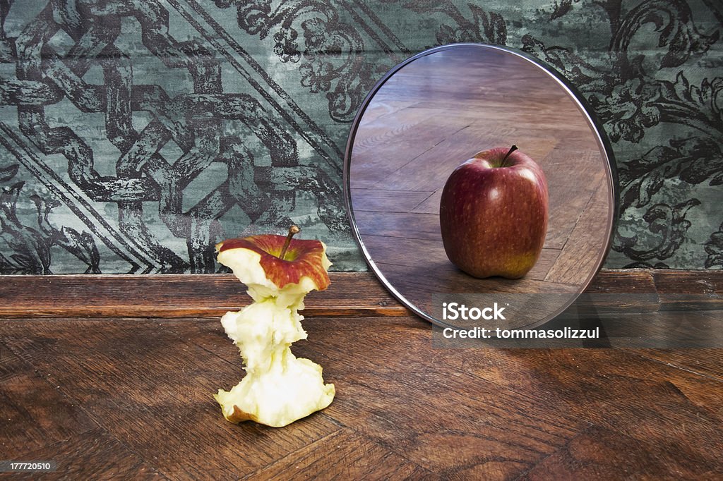surrealistic picture of an apple reflecting in the mirror Mirror - Object Stock Photo