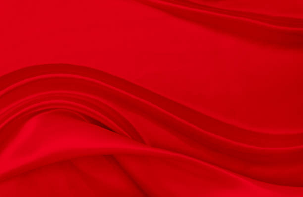 istock Black red satin dark fabric texture luxurious shiny that is abstract silk cloth background with patterns soft waves blur beautiful. 1777207237