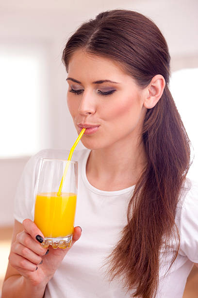 istock Women drinking orange juice 177720807