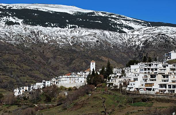 General view of village and snow capped mountains, Capileira, Las Alpujarras, Granada Province, Andalusia, Spain, Western Europe.