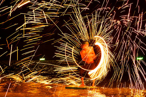 istock amazing fire show in the sea at night 177721778