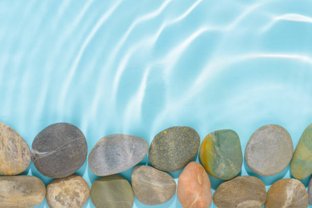 istock stones with sun lights shadow in ripple water over abstract blue background, beautiful abstract space background concept, copy space 1777220283
