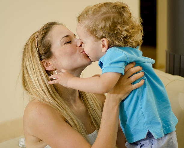 istock Young mom kissing her son 177722379