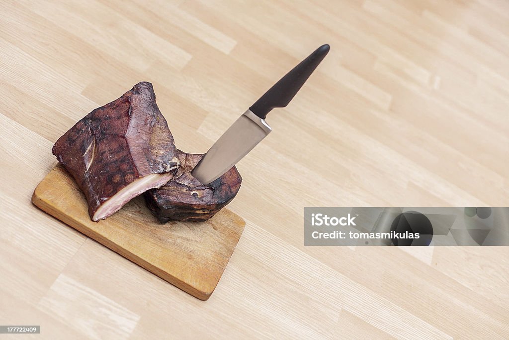 Homemade Smoked Meat On Wooden Cutting Board With Big Knife Stock