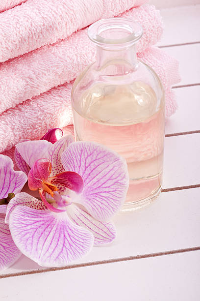 istock pink towels with tropical orchid 177722622