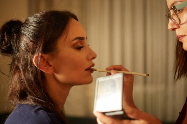 istock woman applying make-up to woman's face 1777227725
