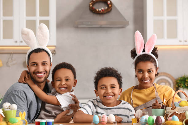 istock Happy African American family painting Easter eggs at table in kitchen 1777231499