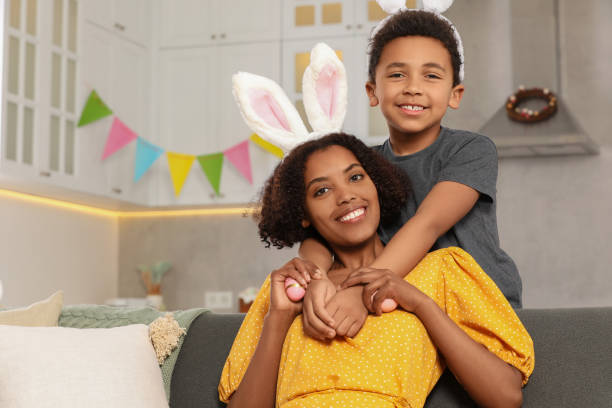 istock Happy African American mother with Easter eggs and her cute son in kitchen 1777232596