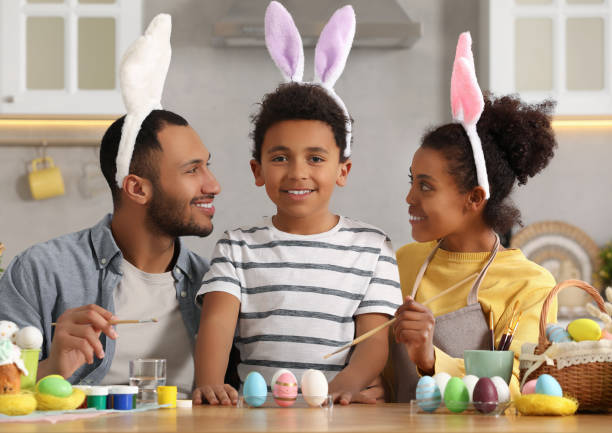 istock Happy African American family painting Easter eggs at table in kitchen 1777234207