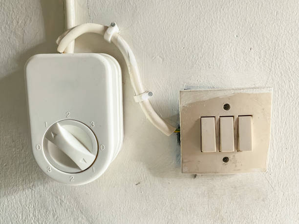 istock ceiling fan regulator, or fan control on white wall background. 1777240249