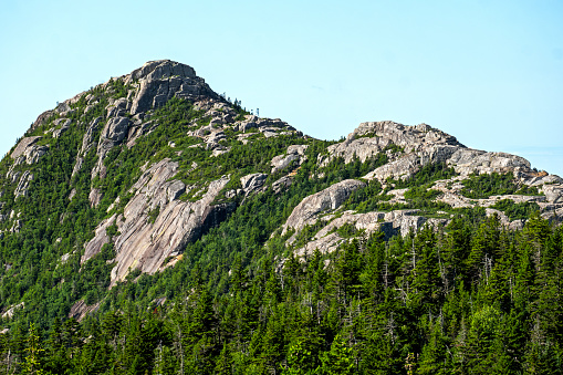A close-up telephoto view of Mount Chocorua's summit on a mid-summer morning in Albany New Hampshire.