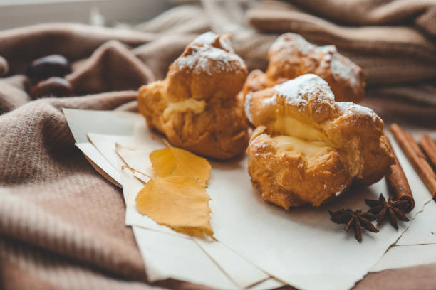 Freshly baked choux pastries close up.