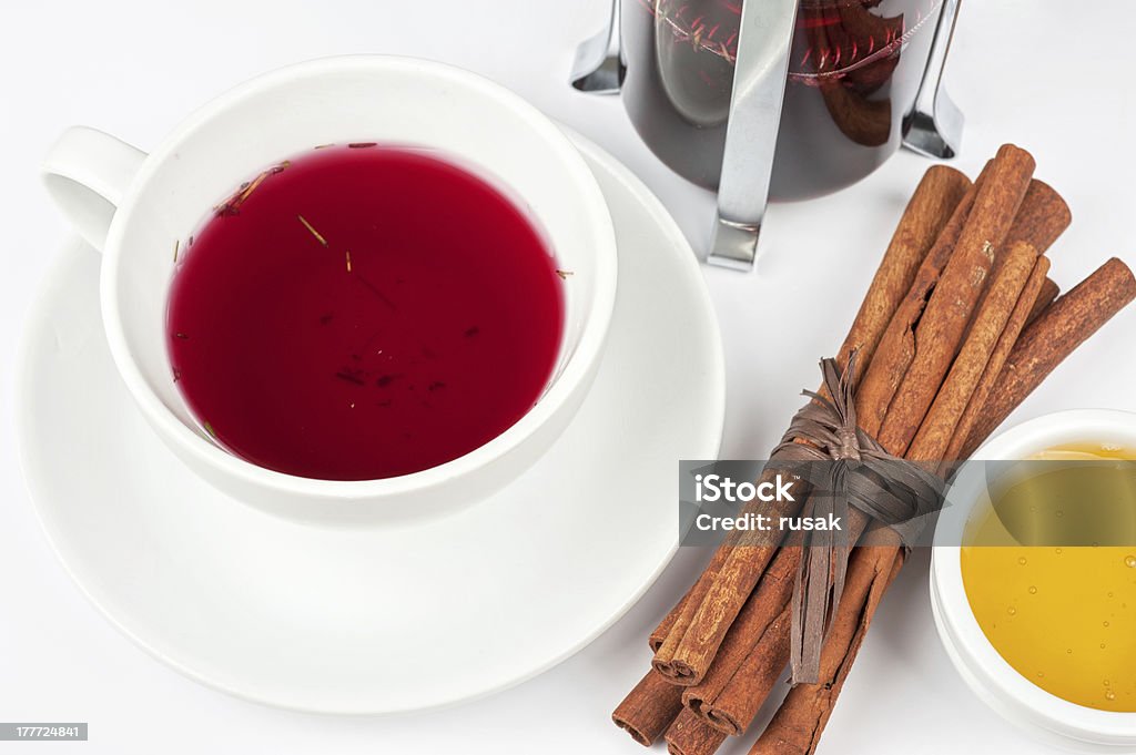 berries tea Cup of tea from blueberry and chabrets with cinnamon sticks, and honey Berry Fruit Stock Photo