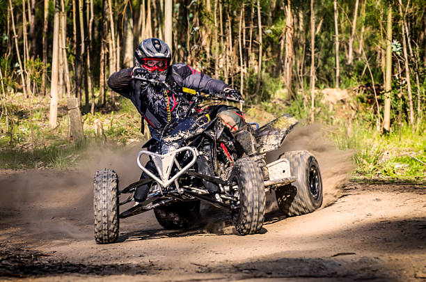 istock ATV racer takes turn during a race. 177724860
